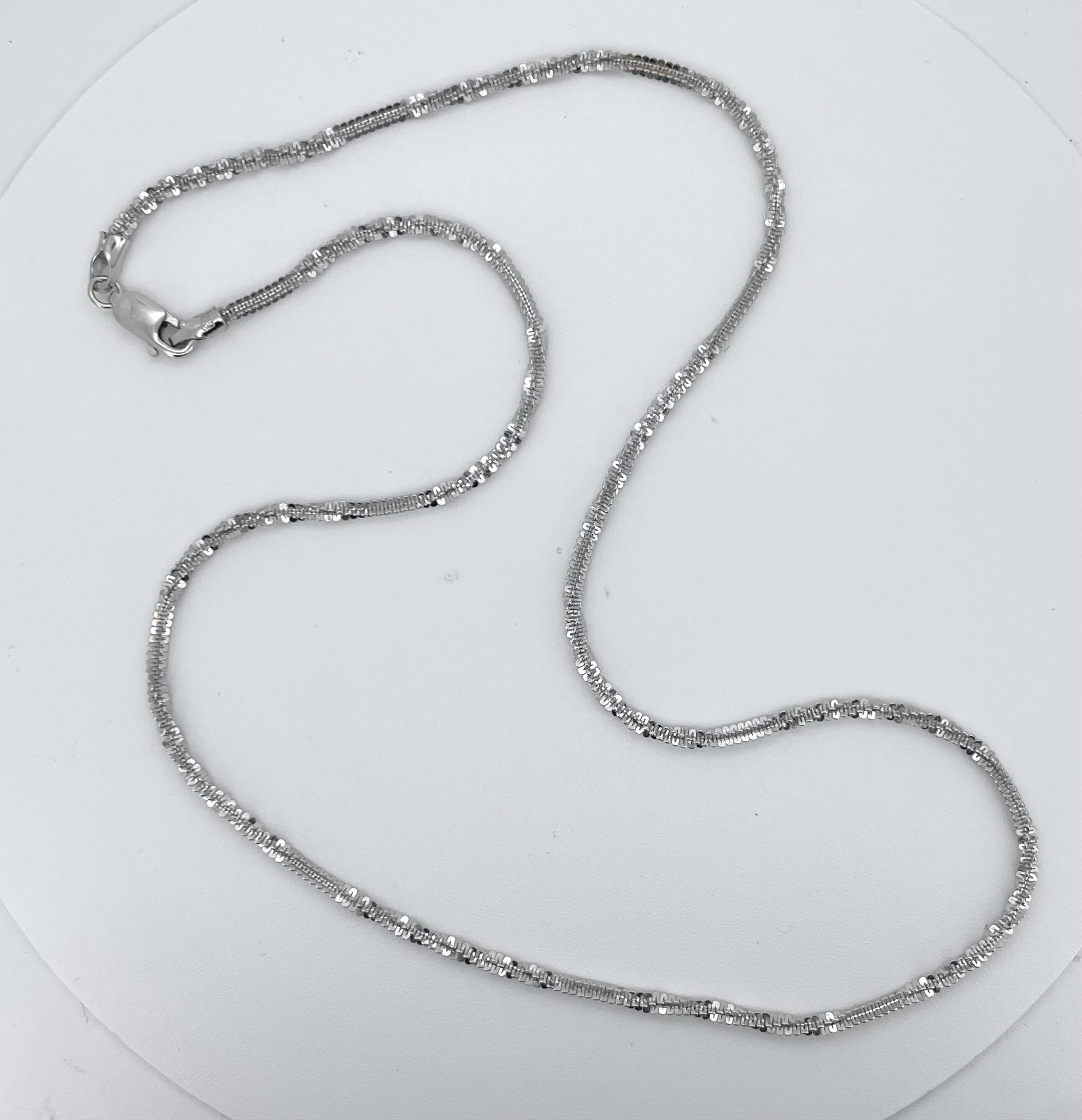 A modern Italian 750 white metal bright cut rope twist chain, 40cm, 6.8 grams.